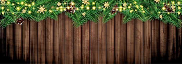 Fir Branches with Neon Lights on Wooden Background Christmas Decoration with Golden Stars