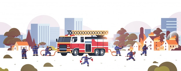 firemen near fire truck getting ready to extinguishing fire firefighters in uniform and helmet firefighting emergency service concept burning houses cityscape background horizontal