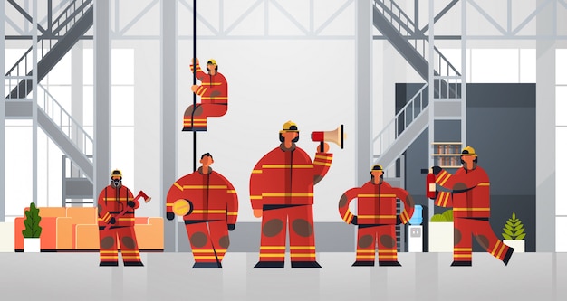 firemen team standing together firefighters wearing uniform and helmet firefighting emergency service concept modern fire department interior flat horizontal full length