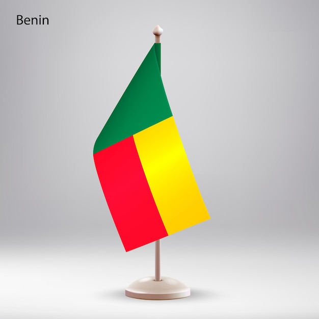 Flag of Benin hanging on a flag stand