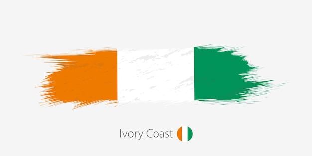 Flag of Ivory Coast grunge abstract brush stroke on gray background