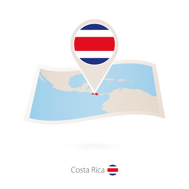 Folded paper map of Costa Rica with flag pin of Costa Rica