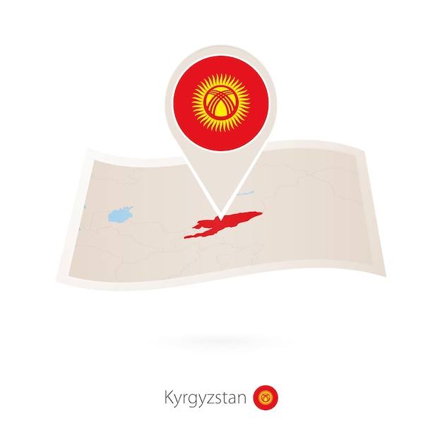 Folded paper map of Kyrgyzstan with flag pin of Kyrgyzstan