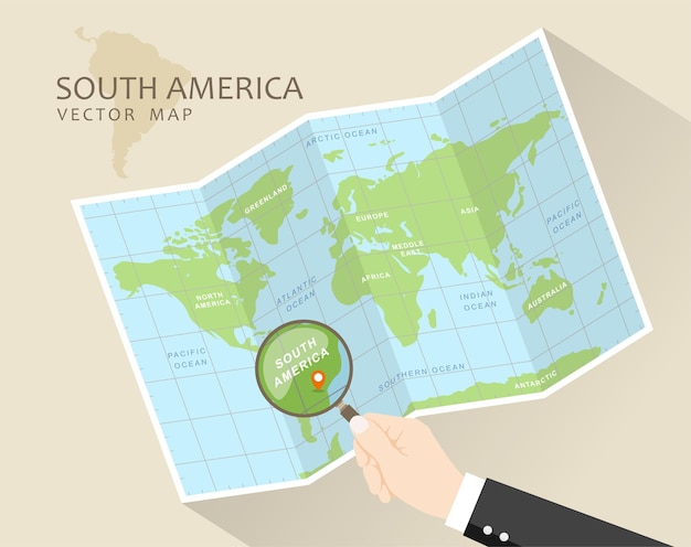 Folded World Map with Magnifying Glass South America in Focus