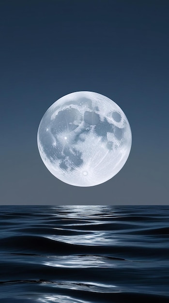 A full moon is shining on the water