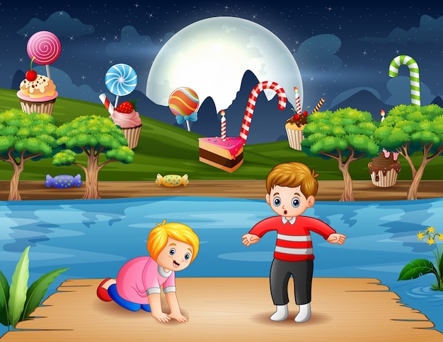 Funny children on the wooden port at night