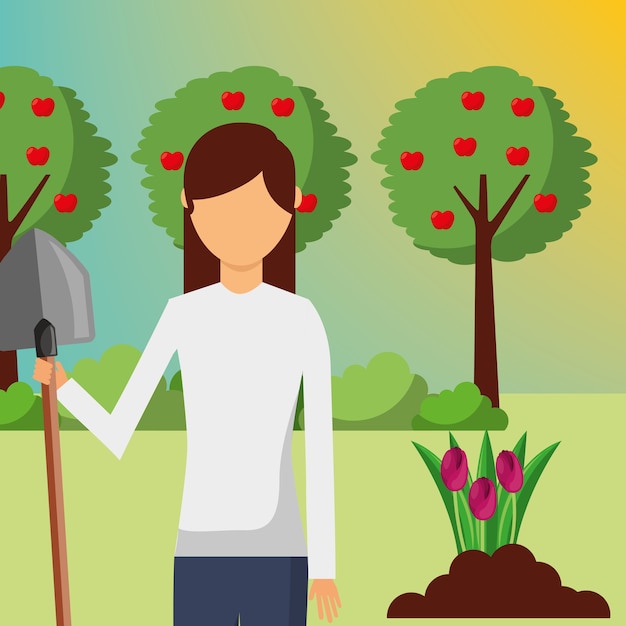 gardener woman with shovel planting in the garden