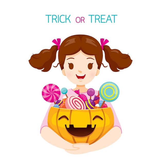 Girl Holding Halloween Pumpkin Bucket Full Of Sweets