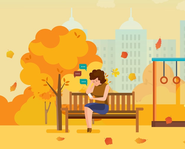 Girl resting in autumn park communicates on phone through messengers