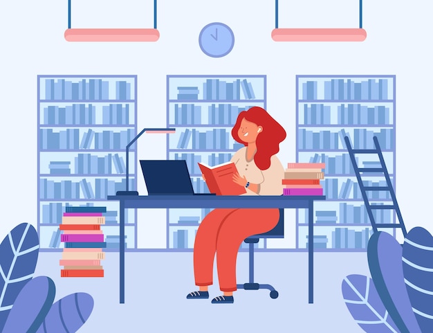 Girl sitting at desk in library and reading book. Cheerful lady studying, looking at laptop screen. Shelves with books in background. Education, knowledge concept