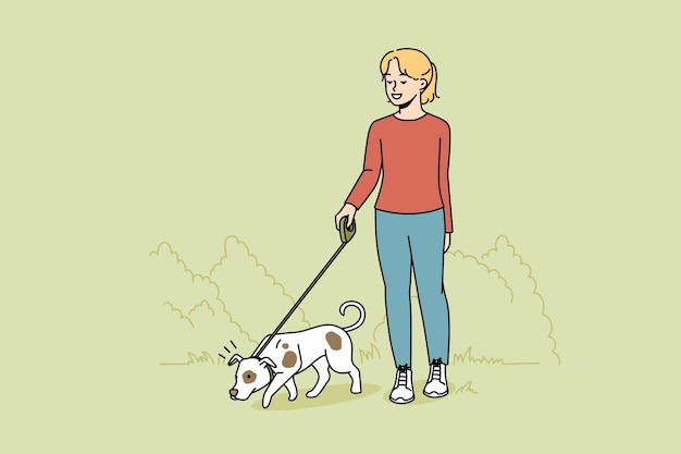 Girl walking dog on leash