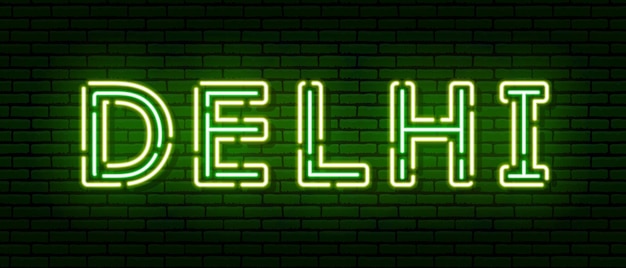 Glowing neon sign with the inscription of the Indian city of Delhi. In green and yellow colors. Against a brick wall. All elements are isolated.