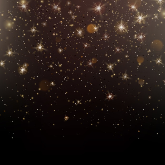 Gold glittering star dust sparkling particles on dark background. 