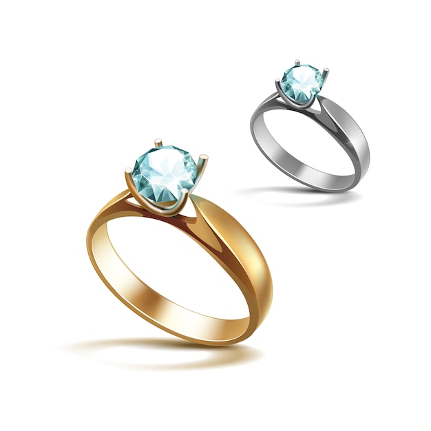 Gold and Siver Engagement Rings with Light Turquoise Shiny Clear Diamond Close up Isolated on White