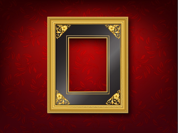 Gold vintage picture frame on red wall 