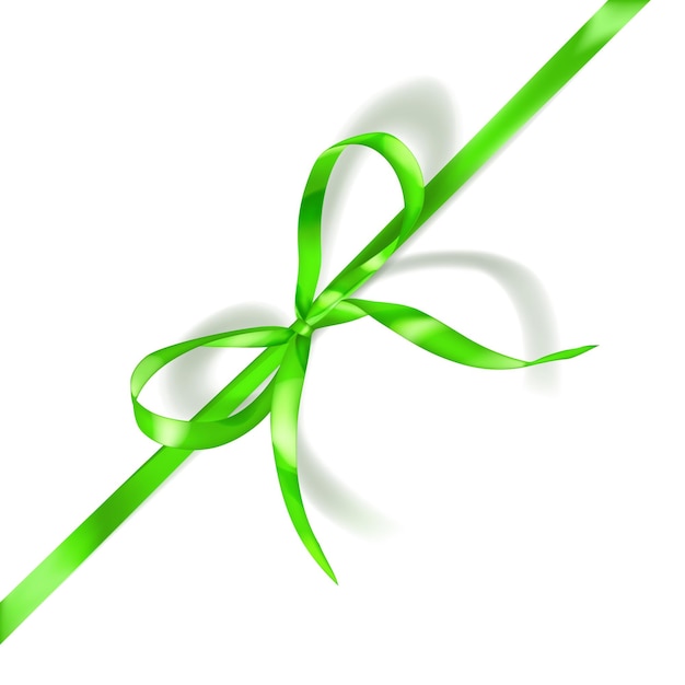 Green bow made of narrow ribbon with shadow on white background Diagonal arrangement