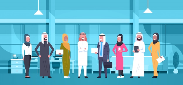 Group Of Arabic Business People In Modern Office Wearing Traditional Clothes Arab Businessman And Businesswoman Employees Workers