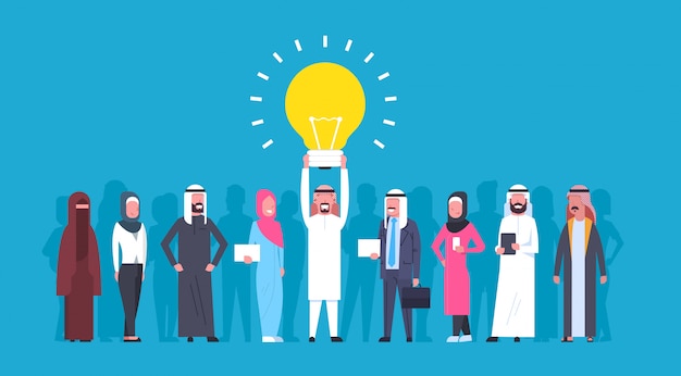 Group Of Arabic Business People With Leader Holding Light Bulb New Idea Concept Arab Businessman And Businesswoman Creative Team