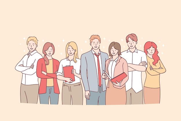 Group of young smiling business workers standing with documents in team together in office and looking at camera