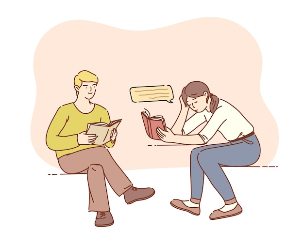 Guy and girl holding and reading book while sitting