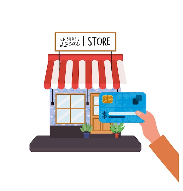 Hand holding credit card in front of local store design of shop retail buy and market theme