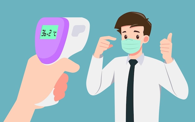 A hand holding digital infrared thermometer checking body temperatures to prove that a businessman who wear mask were safe in the public. Social distancing to safe people from coronavirus, covid-19.