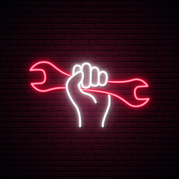 Hand holding wrench neon sign.