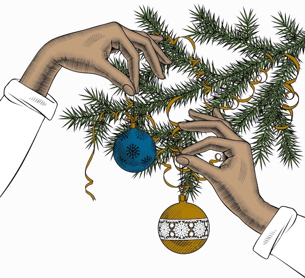 Hands holding a Christmas tree ball with a ribbon