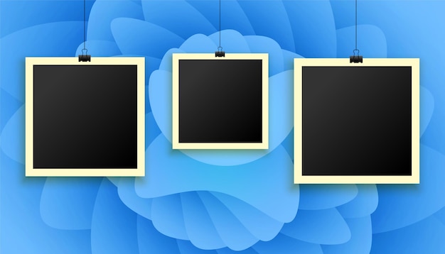 Hanging photo frames on abstract background