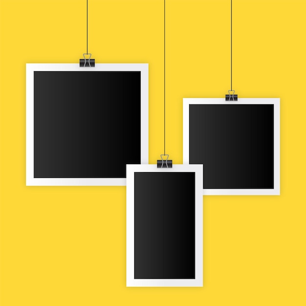 Hanging Photo Frames on Yellow Background EPS 10 Free Vector