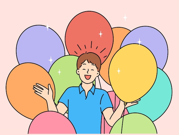 Happy boy with balloons celebrating birthday