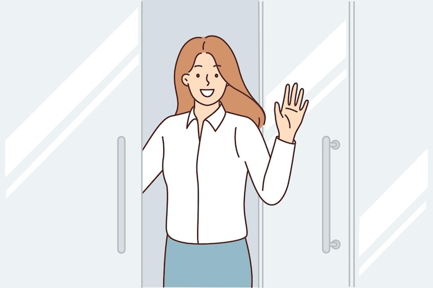 Happy business woman stands at door of business center says welcome and waves hand inviting you to visit corporate office Positive girl office employee says goodbye to colleagues before leaving