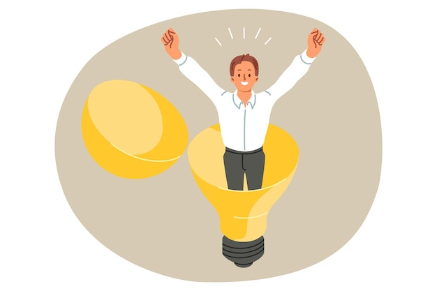 Happy businessman stands inside light bulb raising hands up and rejoicing at new business idea