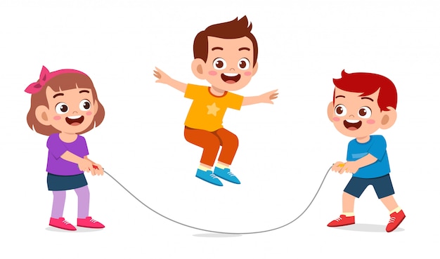 Happy cute kid boy and girl play jump rope