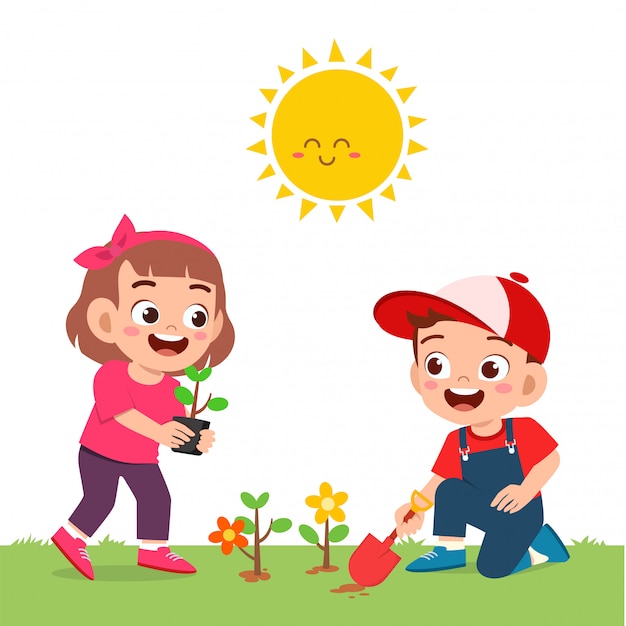 Happy cute little kid boy and girl plant flower