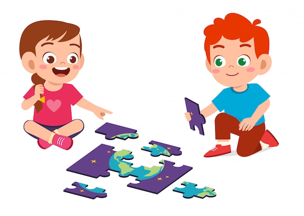 Happy cute little kid boy and girl play jigsaw puzzle