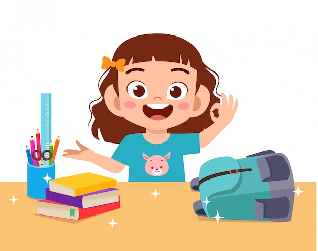 Happy cute little kid girl with clean desk