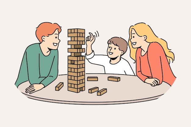 Happy family plays jenga with child enjoying board game and developing fine motor skills in baby