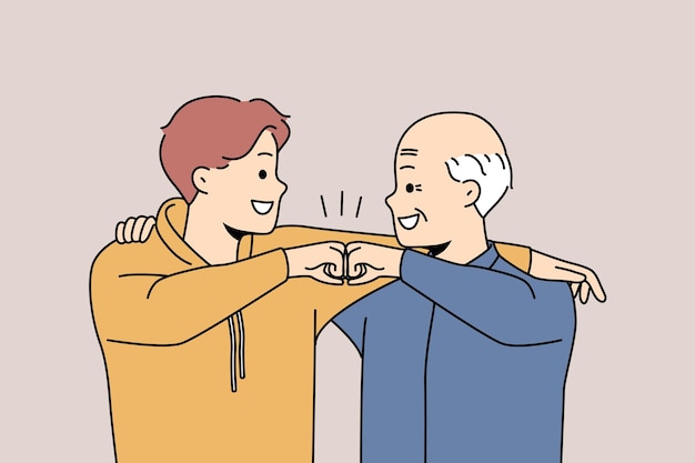 Happy grandfather and grandson give fists bump