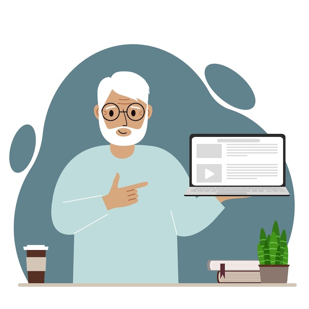 Happy grandfather holding a laptop computer with one hand and pointing at it with the other. Laptop computer technology concept.