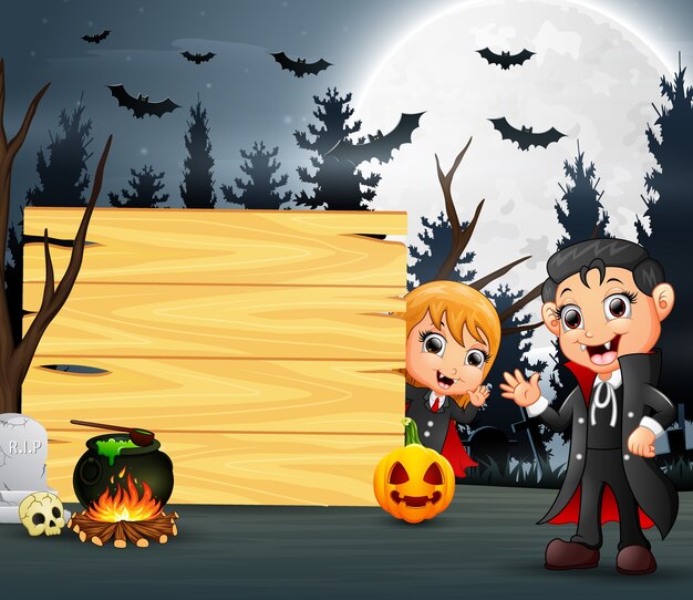 Happy halloween with two vampire and wooden board