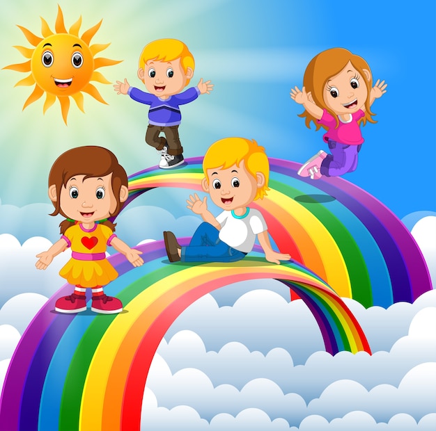 happy kids standing over the rainbow