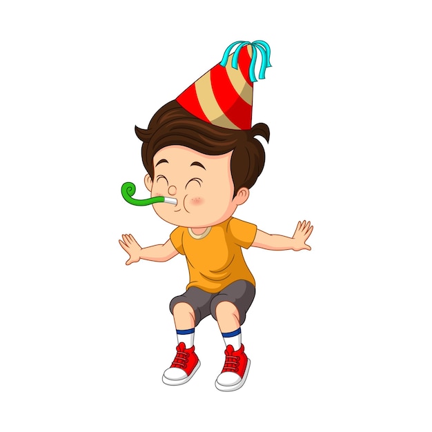 Happy little boy blowing a paper trumpet