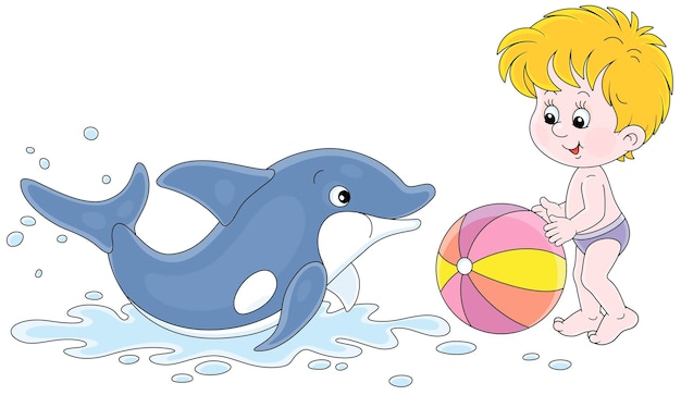 Happy little boy and a merry playful dolphin playing a colorful ball on a summer beach beside a sea