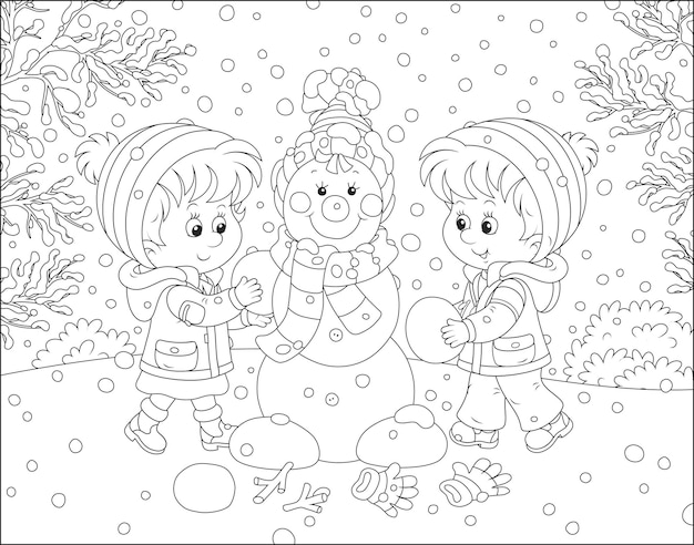 Happy little children making a funny Christmas snowman in a snowy winter park