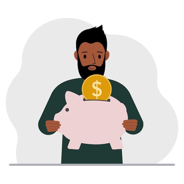 Happy man holds a piggy bank a coin falls into the piggy bank The concept of saving finance savings investing finances