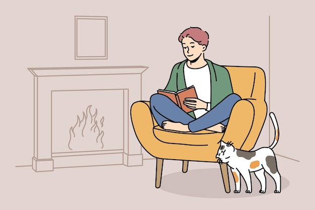 Happy man relax in chair near fireplace with book