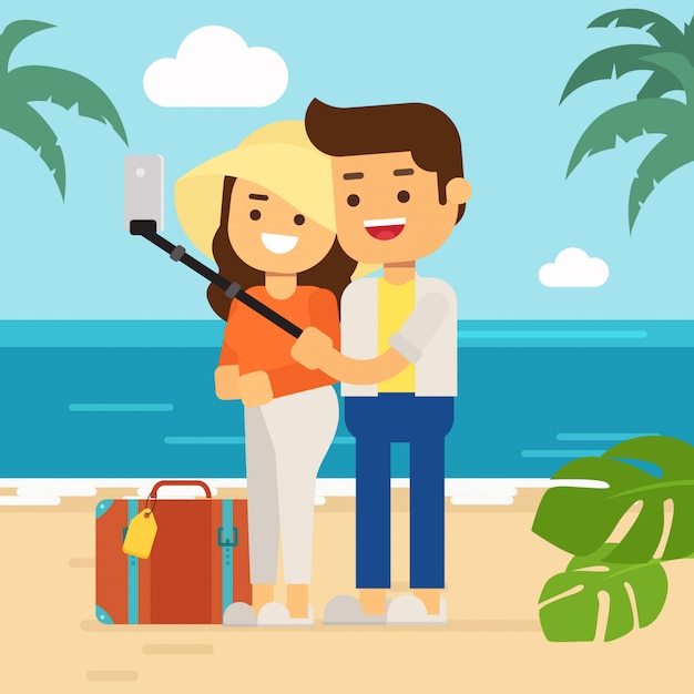 Happy man and woman at the beach in summer holiday, touristic couple on tropical island with their luggage making selfie