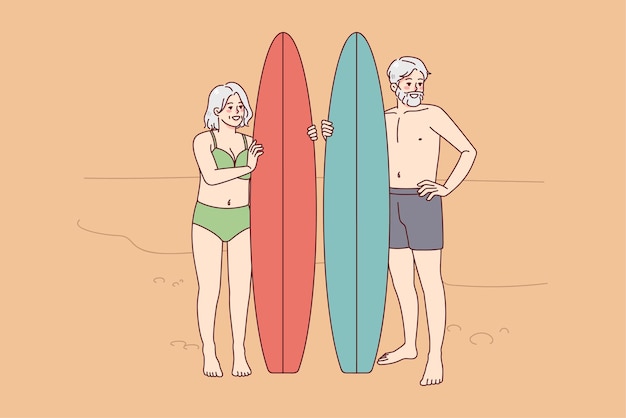 Happy mature people with surfboard