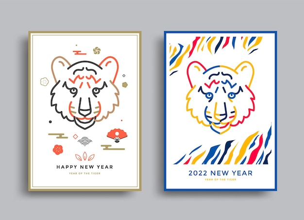 Happy New year 2022 posters with tiger face The year of the tiger Japanese new year invite Vector